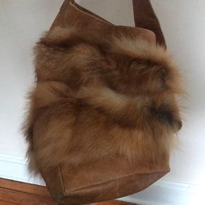 Red fox and leather bag